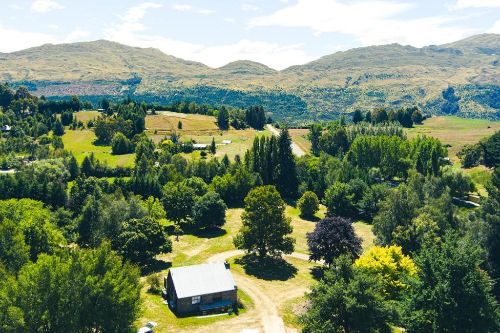 an aerial view of a farm with a truck at The Cottage in Queenstown