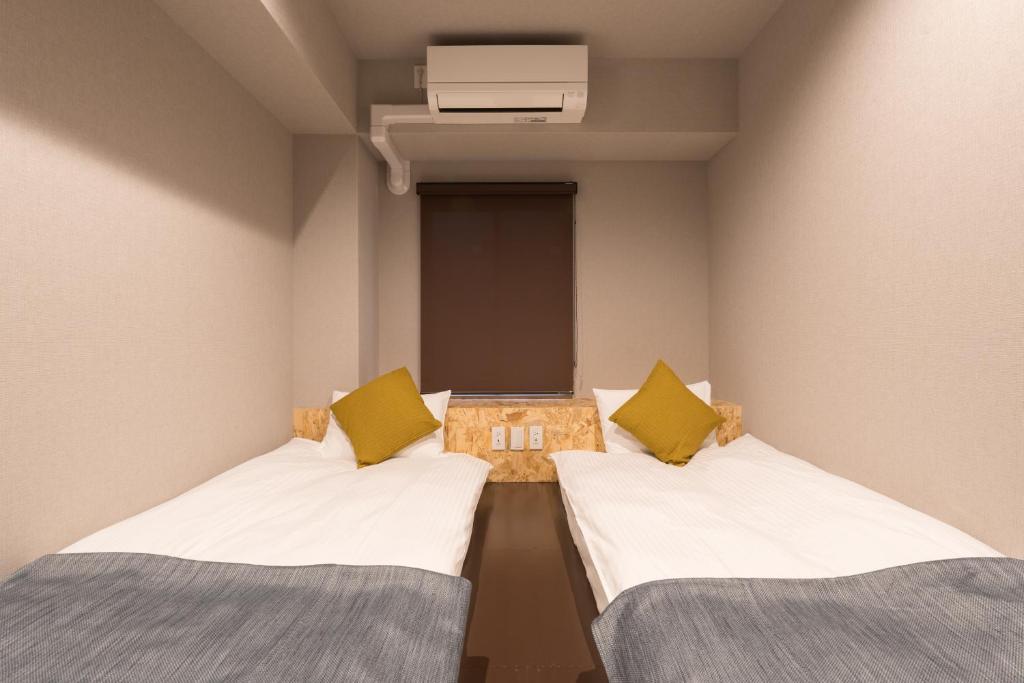 Postel nebo postele na pokoji v ubytování 3U NAMBA MINAMI by DOYANEN