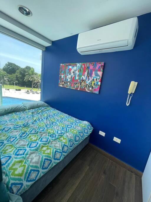 Postel nebo postele na pokoji v ubytování Piscina Mar en el Paraíso Caribe
