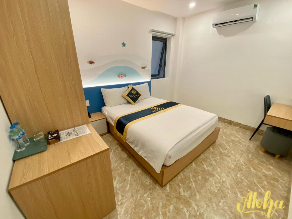 Postel nebo postele na pokoji v ubytování Aloha Hotel Vung Tau