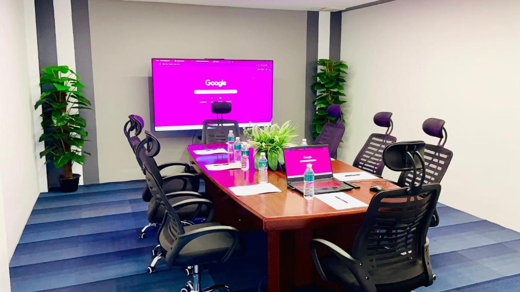 A small meeting room arranged around a conference table.