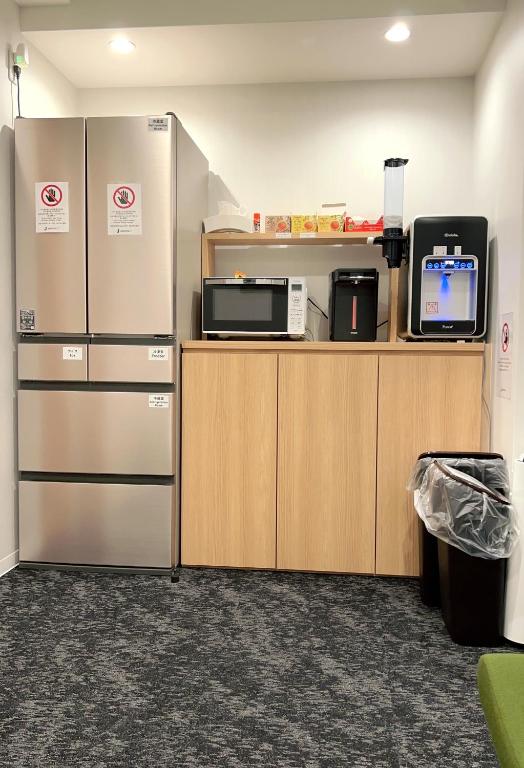 Kuchyň nebo kuchyňský kout v ubytování 難波ゲストハウスjakotelplus 難波店