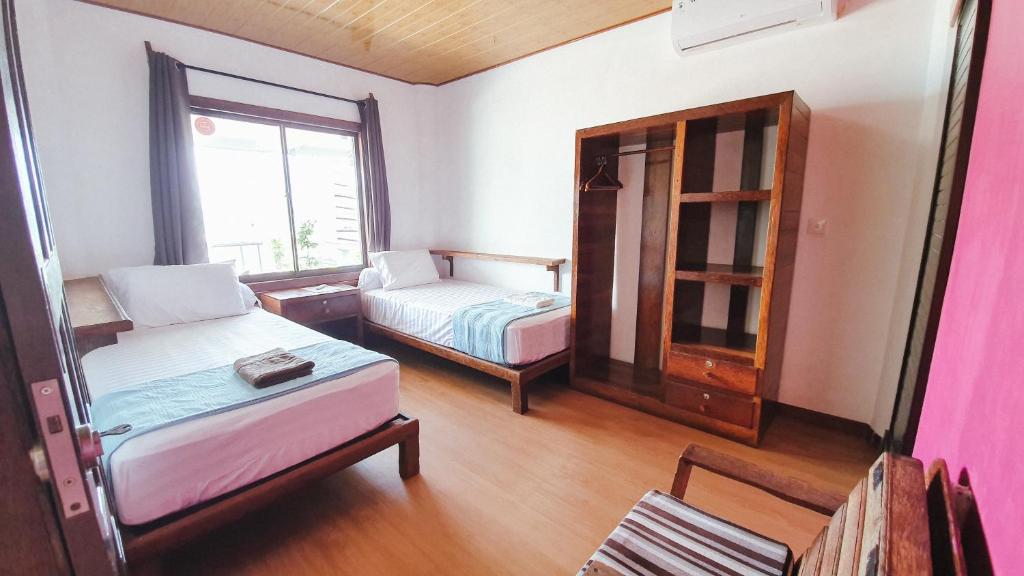 Postel nebo postele na pokoji v ubytování Jamburae Lodge