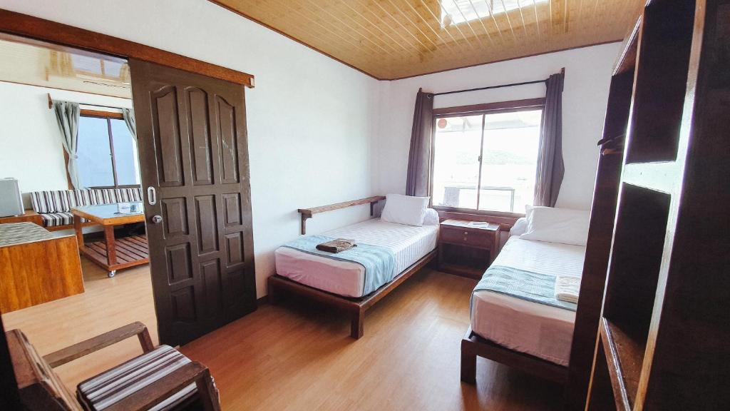 Postel nebo postele na pokoji v ubytování Jamburae Lodge