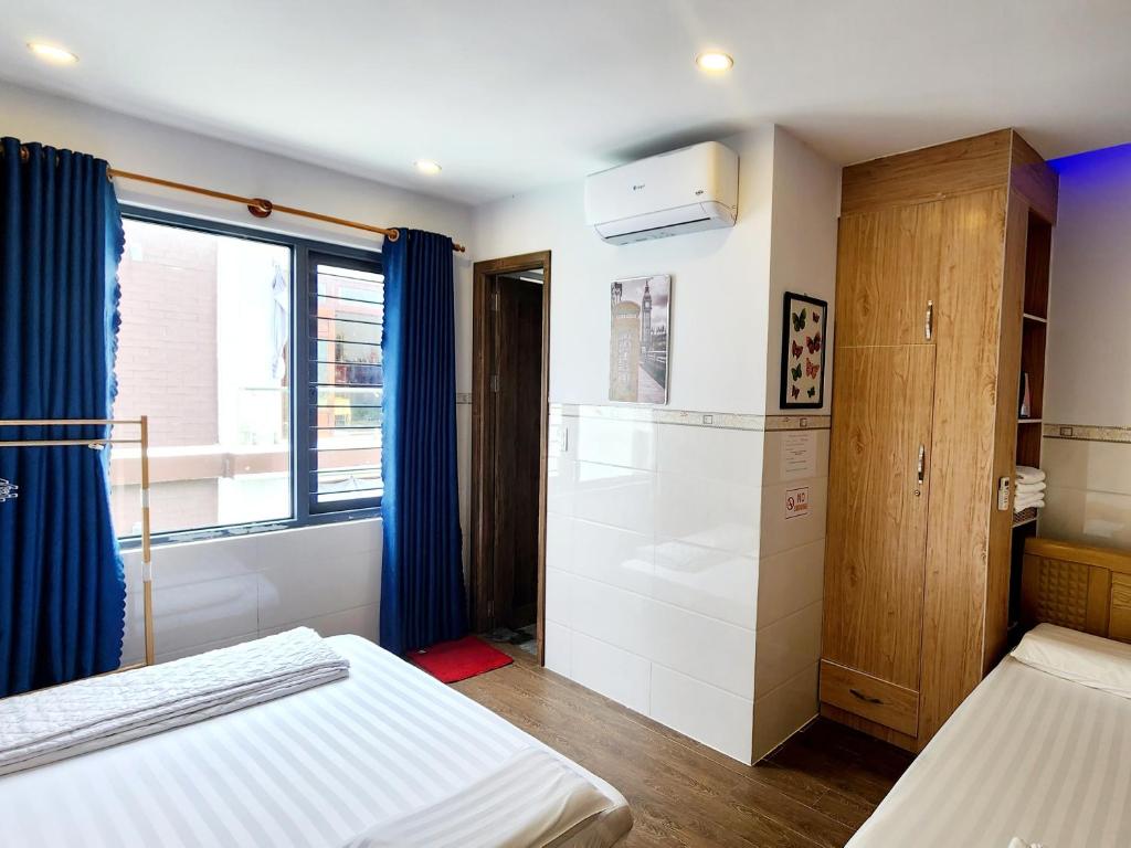 Postel nebo postele na pokoji v ubytování Sena home 3*3*Near Danang Dragon bridge*Han river