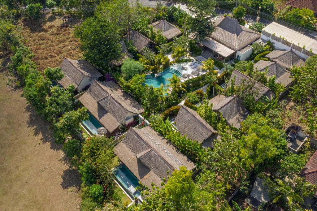 an overhead view of a bunch of houses with a pool at Gypsea Bali in Uluwatu