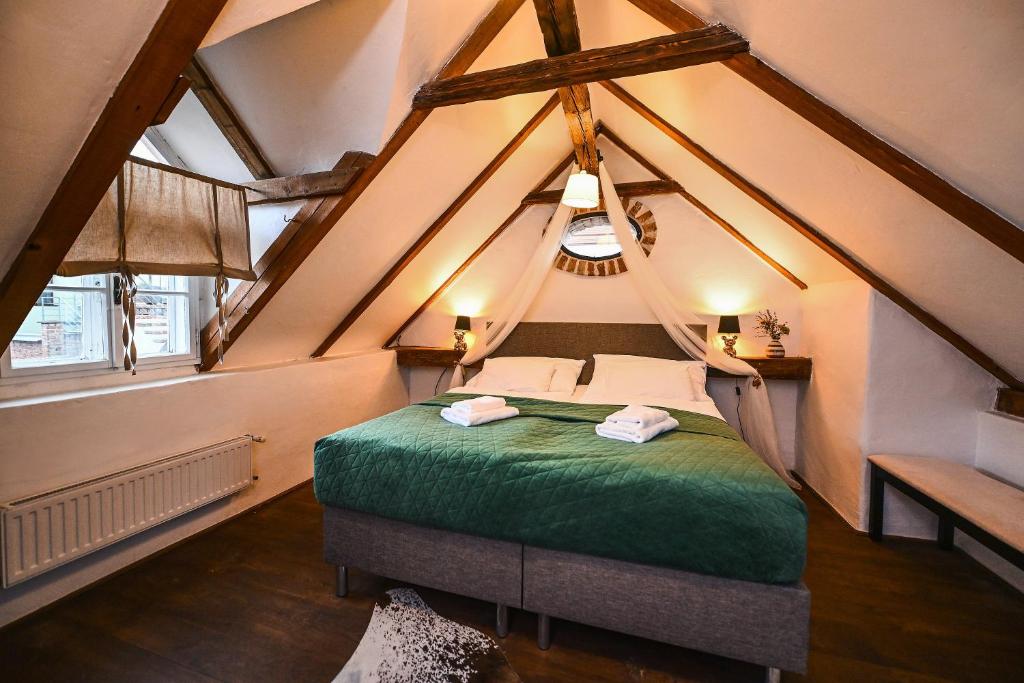 Postel nebo postele na pokoji v ubytování Boutique Apartman Mikulov
