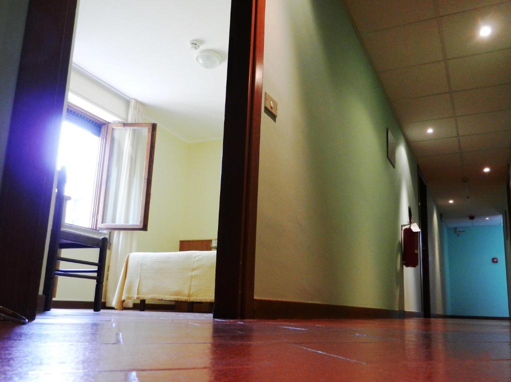 Postel nebo postele na pokoji v ubytování Albergo Milano