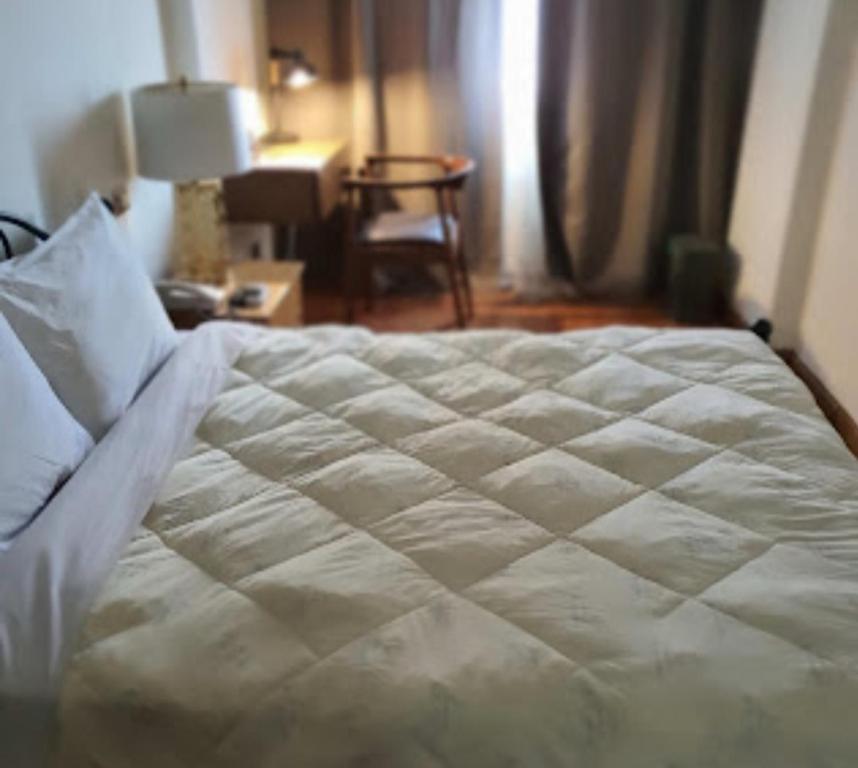 Postel nebo postele na pokoji v ubytování Memory Hotel