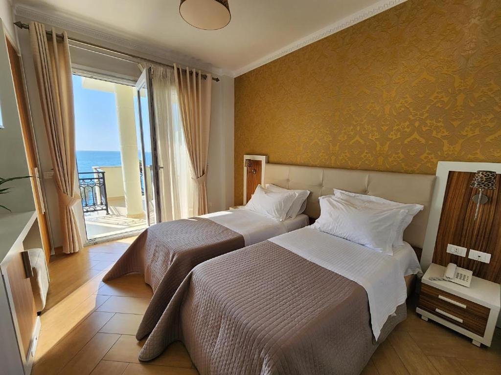 Postel nebo postele na pokoji v ubytování Hotel Gold