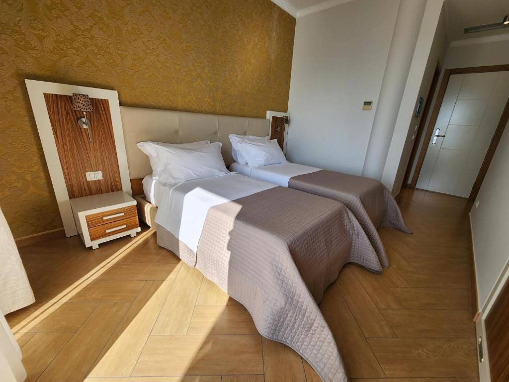 Postel nebo postele na pokoji v ubytování Hotel Gold