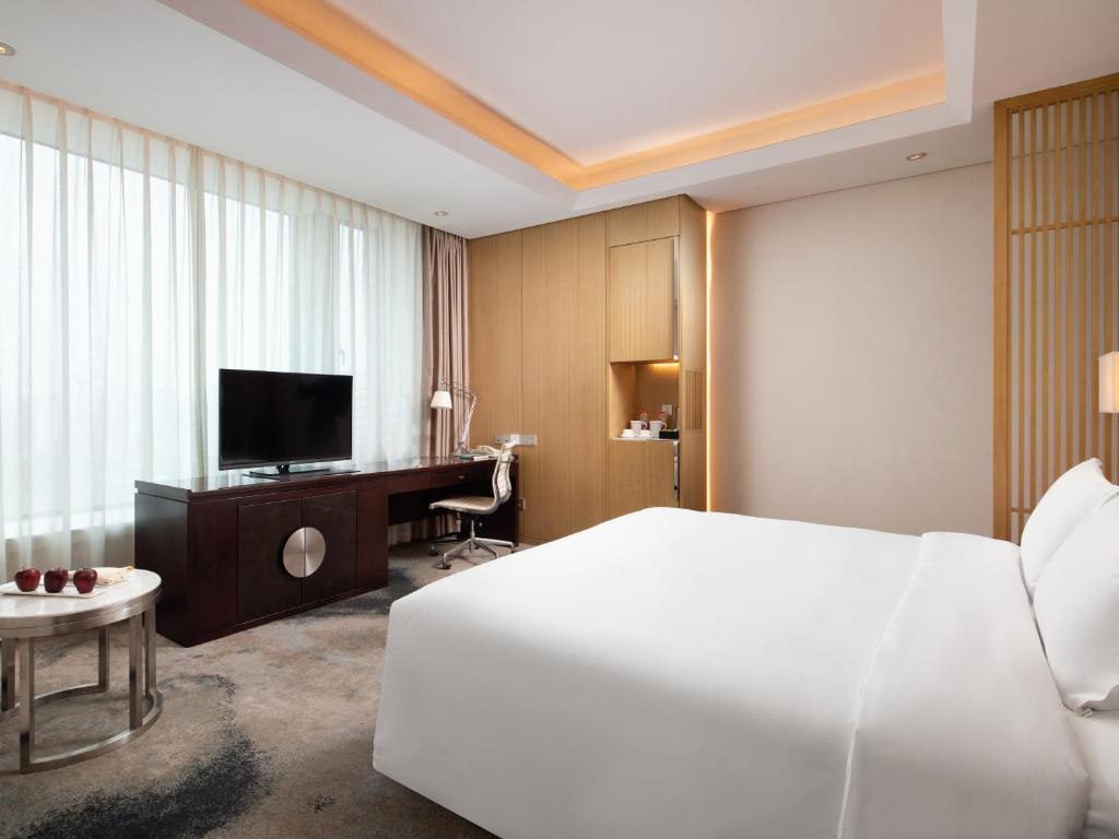 TV a/nebo společenská místnost v ubytování Yun Hotel Wuhan