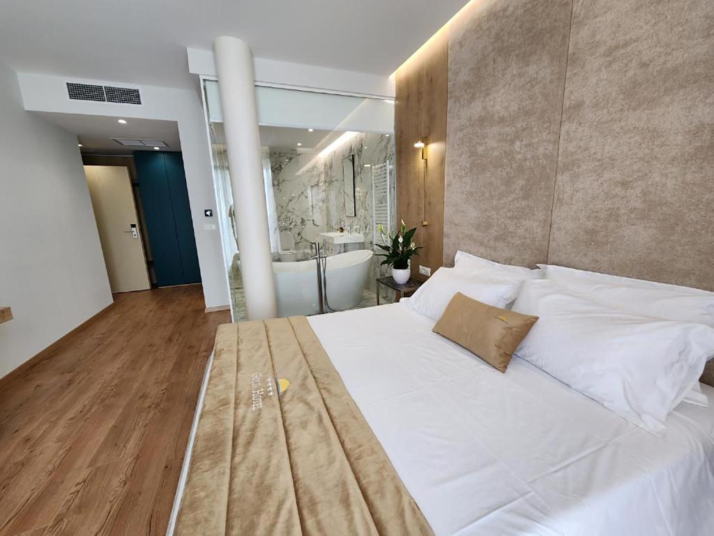 Postel nebo postele na pokoji v ubytování Hotel Gold