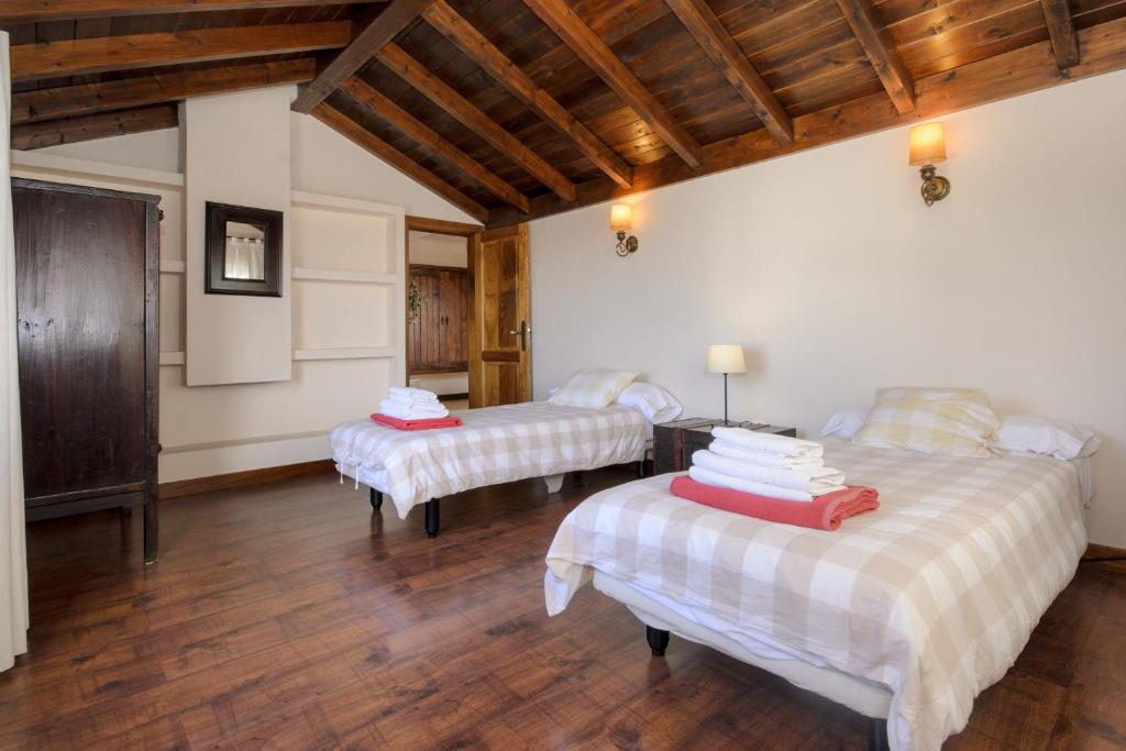 Posteľ alebo postele v izbe v ubytovaní Casa Perdomo
