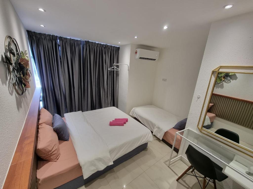 Postel nebo postele na pokoji v ubytování One Point Hotel