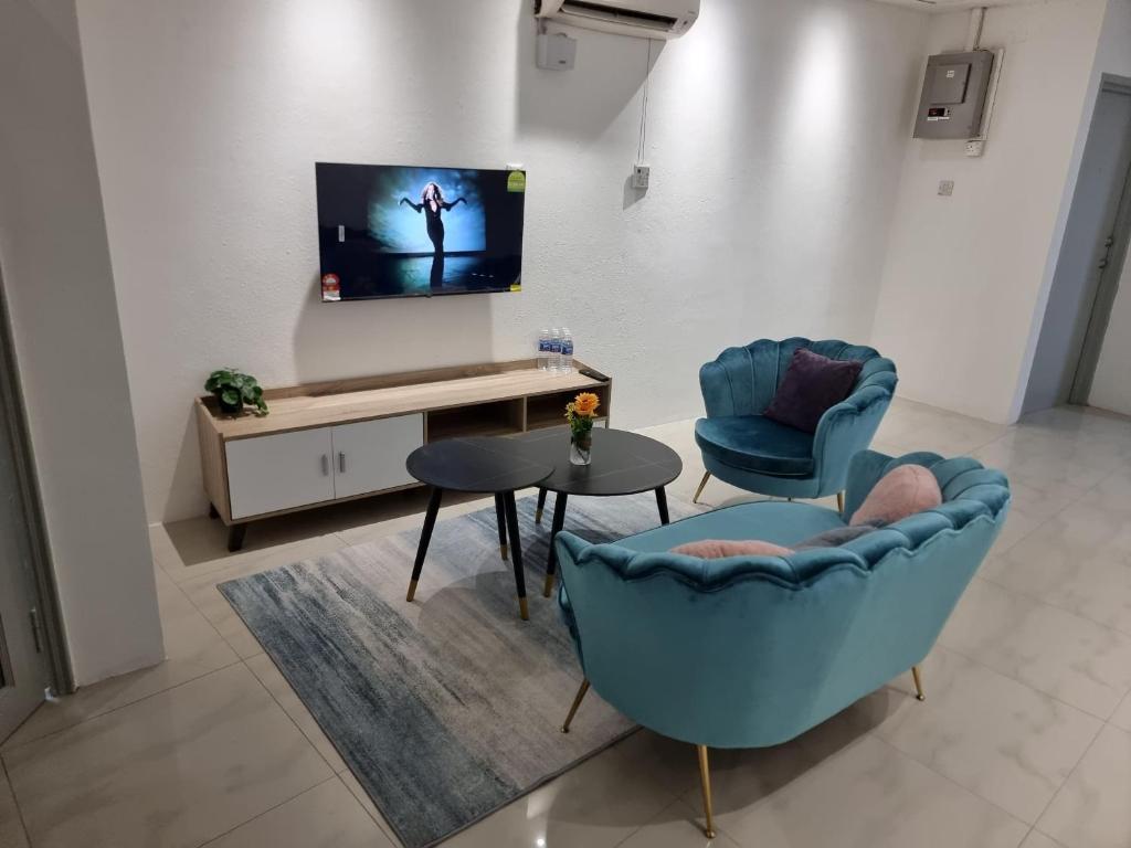 TV a/nebo společenská místnost v ubytování One Point Hotel