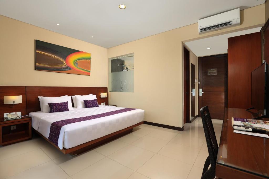 Postel nebo postele na pokoji v ubytování Amadea Resort & Villas Seminyak Bali