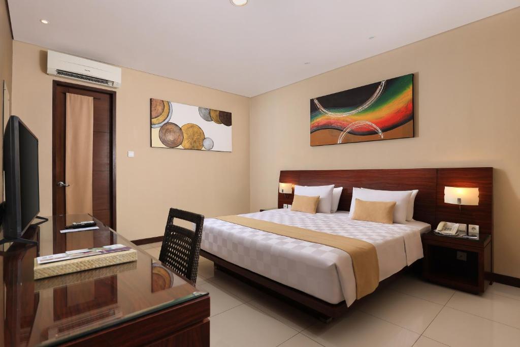 Postel nebo postele na pokoji v ubytování Amadea Resort & Villas Seminyak Bali