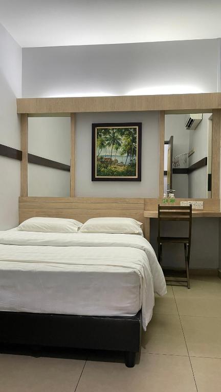 Postel nebo postele na pokoji v ubytování GOPENG INN