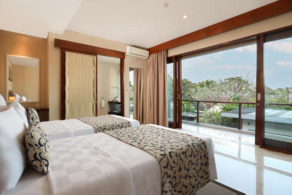 Postel nebo postele na pokoji v ubytování Amadea Resort & Villas Seminyak Bali