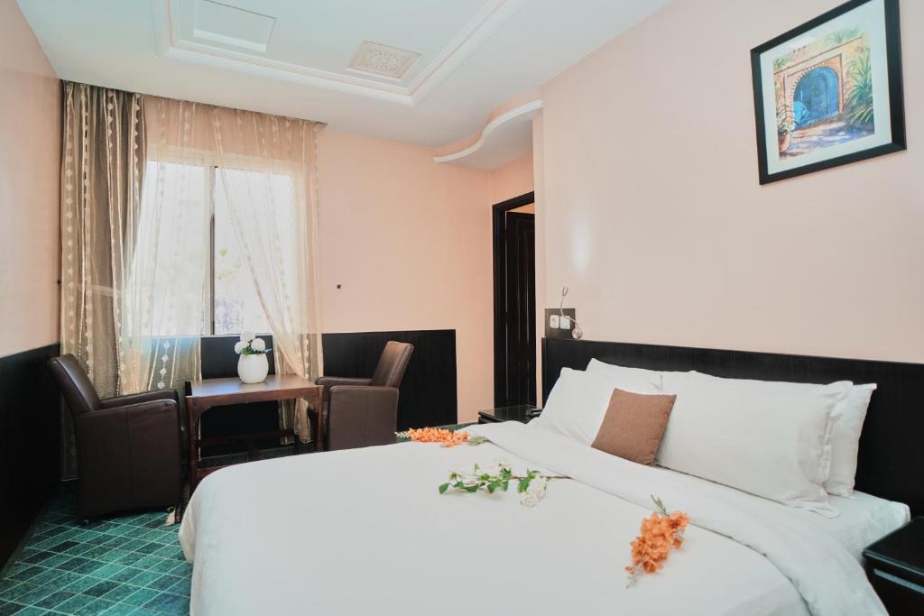 Postel nebo postele na pokoji v ubytování Hôtel Texuda