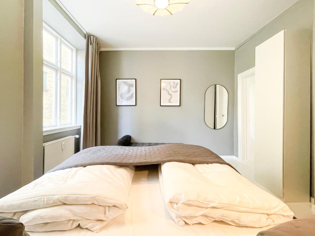 Postel nebo postele na pokoji v ubytování Beautiful One-Bedroom Apartment in CPH City
