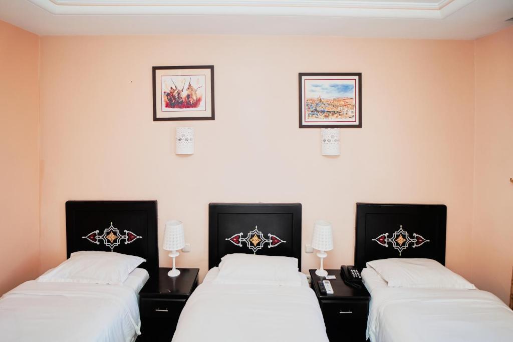 Postel nebo postele na pokoji v ubytování Hôtel Texuda