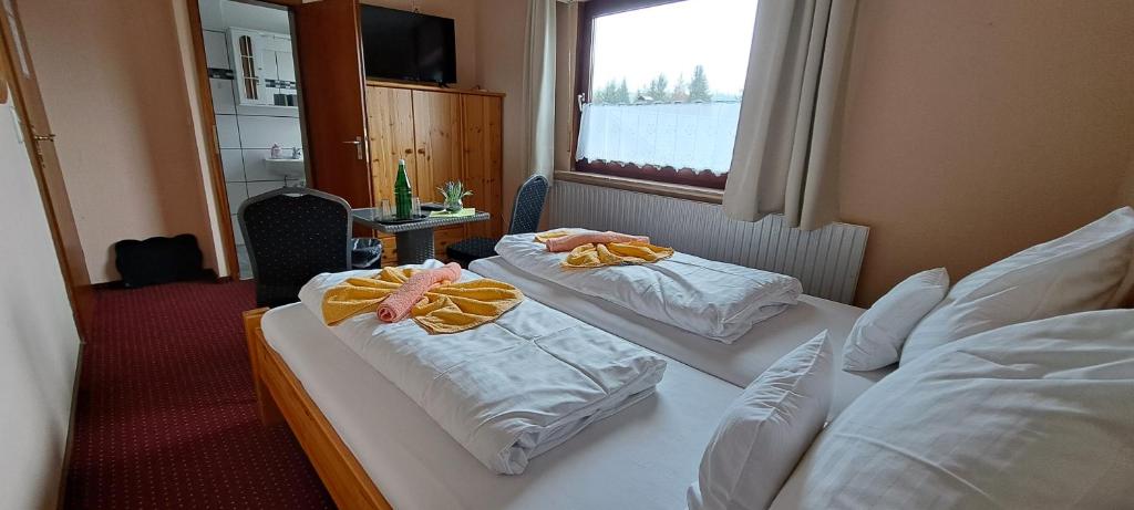 Postel nebo postele na pokoji v ubytování Quellenhof Altenau