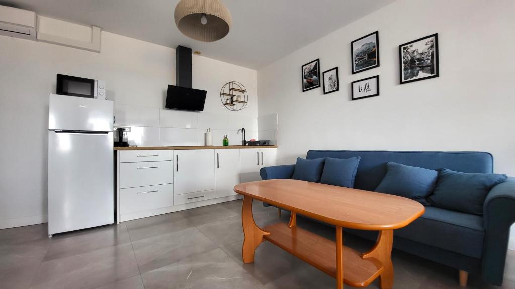 Kuchyňa alebo kuchynka v ubytovaní Apartamenty Czerwona Stodoła
