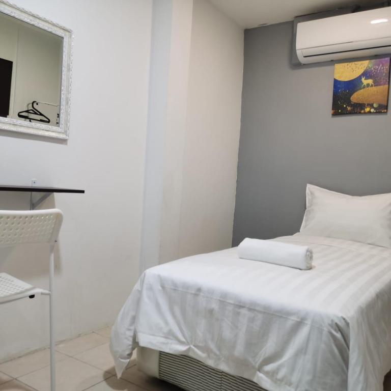 Postel nebo postele na pokoji v ubytování Hotel Seroja