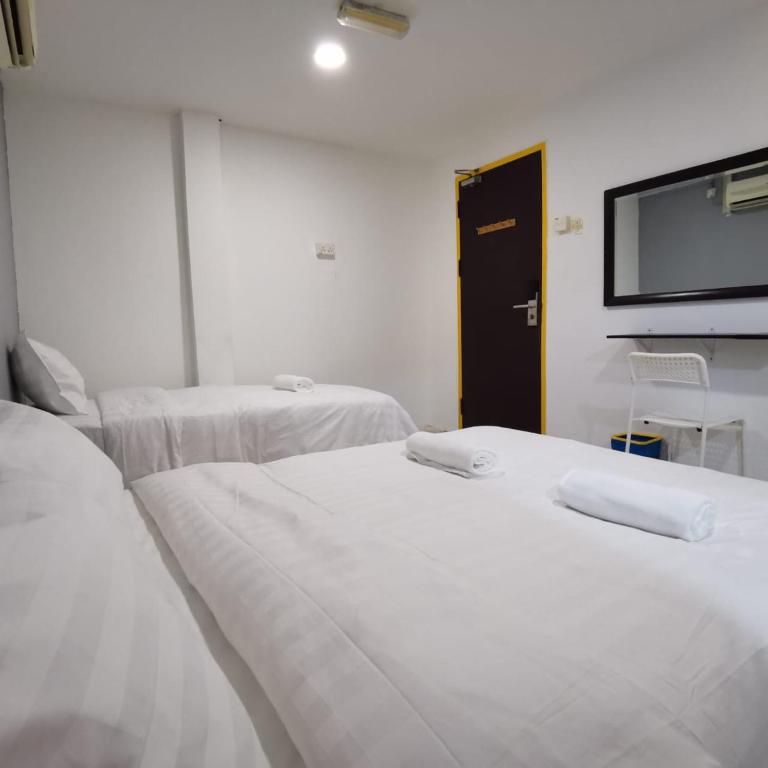 Postel nebo postele na pokoji v ubytování Hotel Seroja