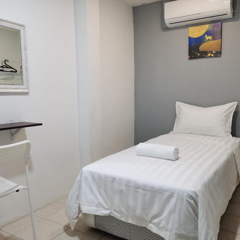 Postel nebo postele na pokoji v ubytování Hotel Seroja