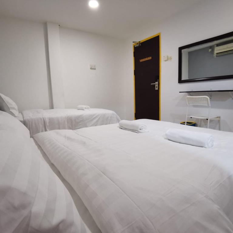 Postel nebo postele na pokoji v ubytování Hotel Seroja