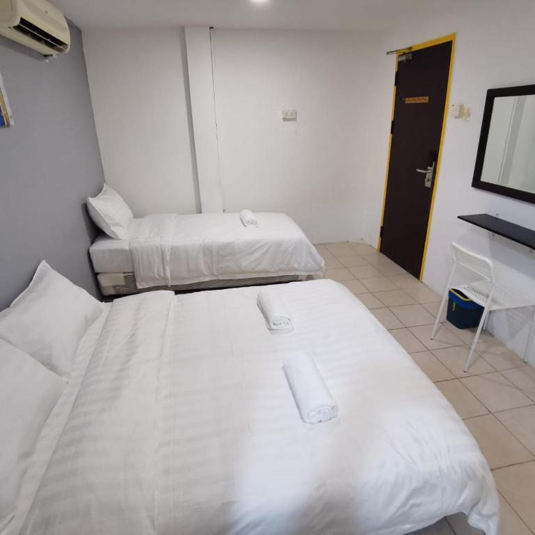Postel nebo postele na pokoji v ubytování Hotel Seroja