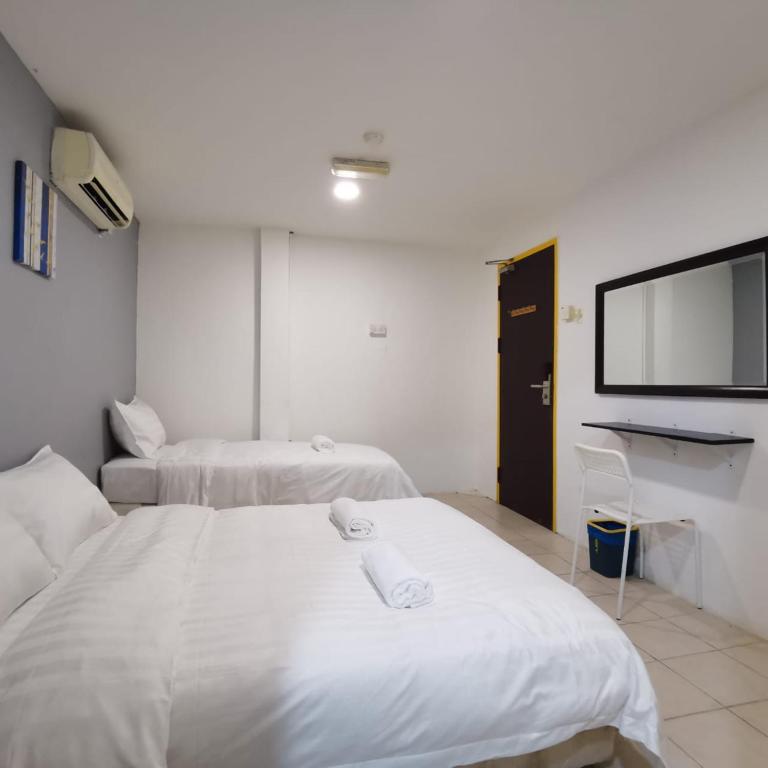 Postel nebo postele na pokoji v ubytování Hotel Seroja