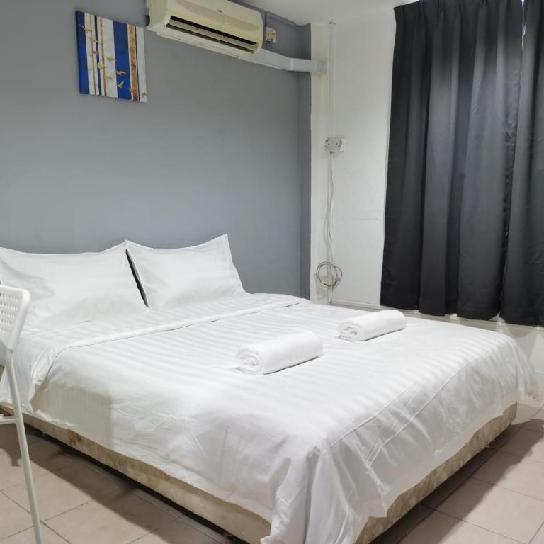 Postel nebo postele na pokoji v ubytování Hotel Seroja