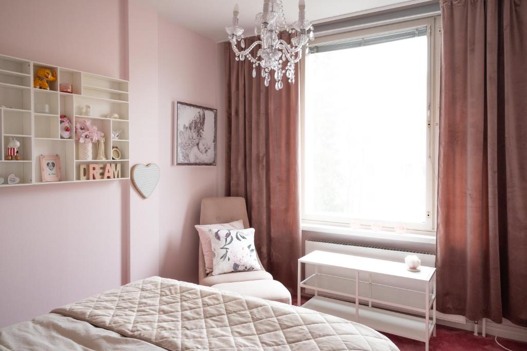 Postel nebo postele na pokoji v ubytování City Apartment Lumikko