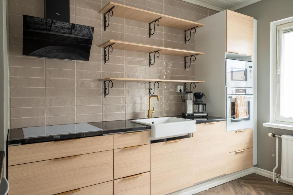 Kuchyň nebo kuchyňský kout v ubytování City Apartment Lumikko