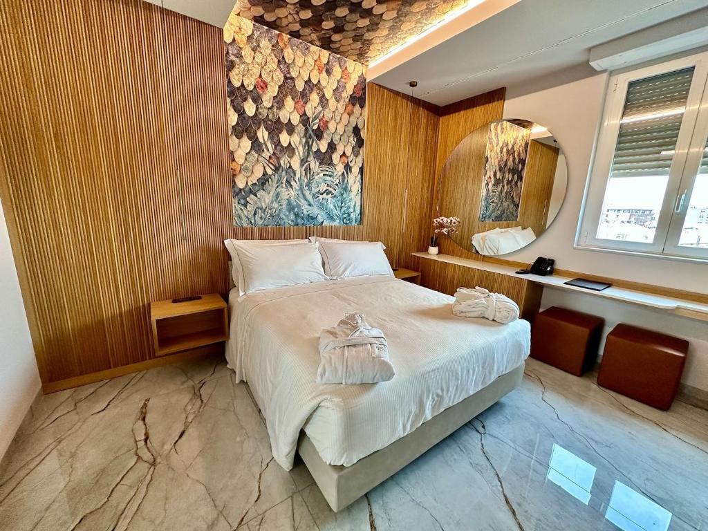 Postel nebo postele na pokoji v ubytování Hotel Ariston