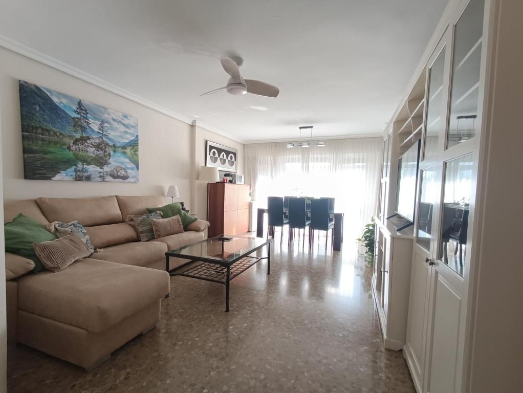 a living room with a couch and a table at Feria apartment, near Plaza España in Seville