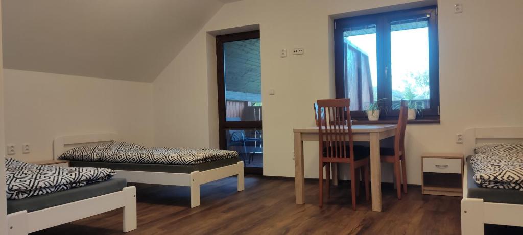 Postel nebo postele na pokoji v ubytování Penzion Bystřička