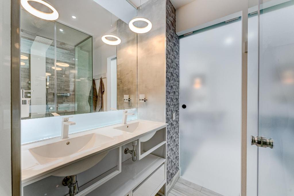 a bathroom with a sink and a mirror at BAL Apartments Adults Only in Arona