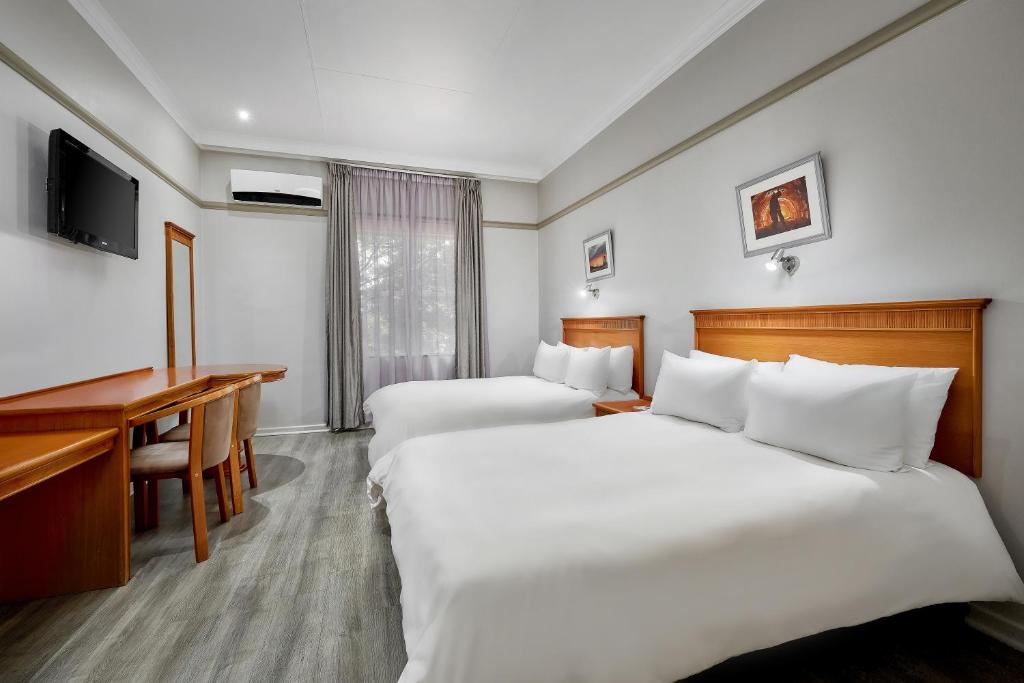 Katil atau katil-katil dalam bilik di Protea Hotel by Marriott Klerksdorp