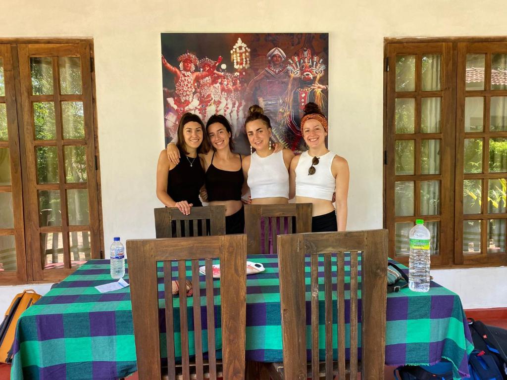 a group of women standing around a table at Lake Island Home Stay in Dambulla