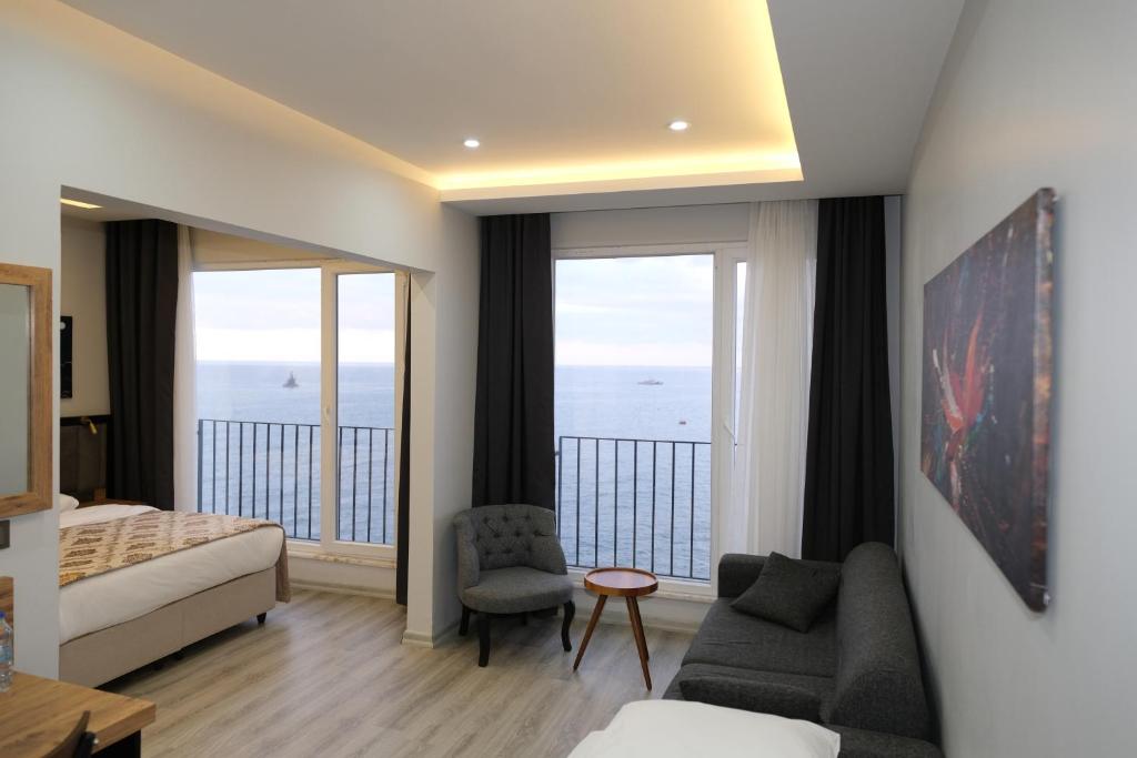 A bed or beds in a room at The Marine Hotel