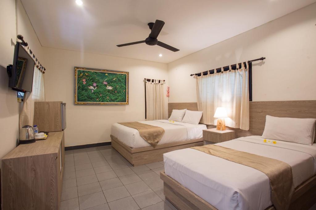 Postel nebo postele na pokoji v ubytování Grand Sehati & Spa, Ubud