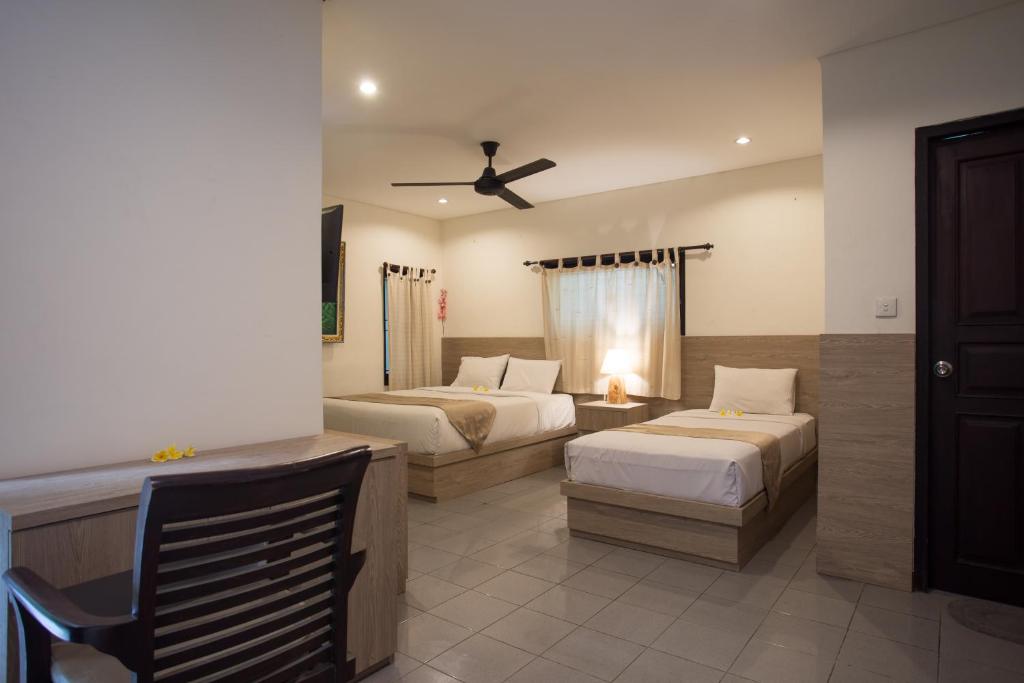 Postel nebo postele na pokoji v ubytování Grand Sehati & Spa, Ubud