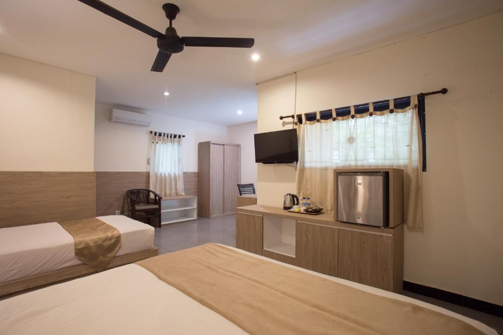 Postel nebo postele na pokoji v ubytování Grand Sehati & Spa, Ubud