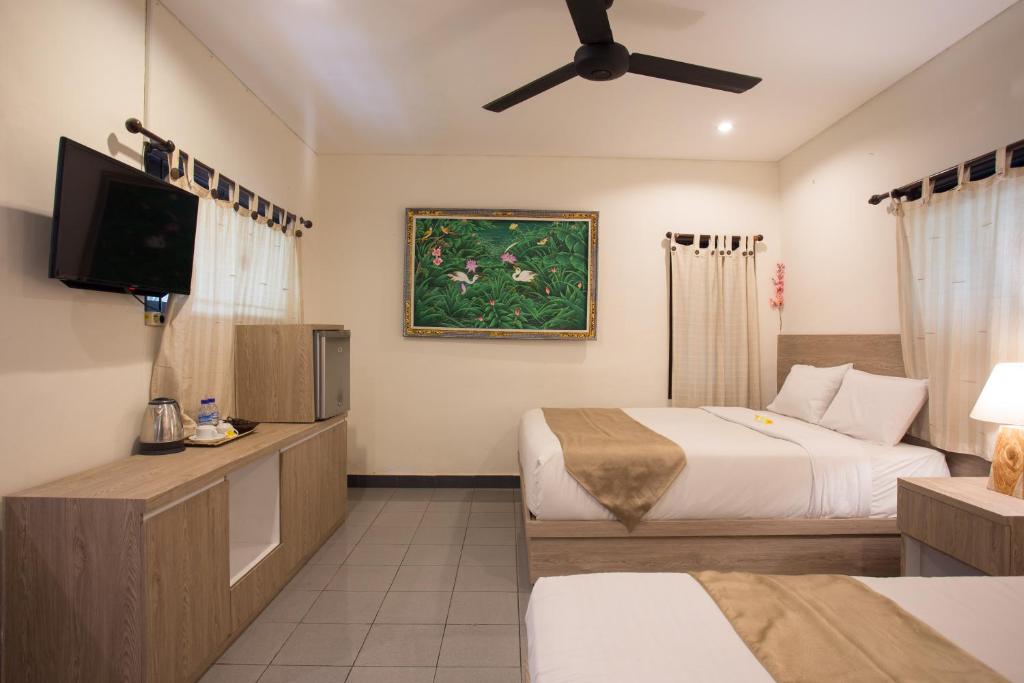 Postel nebo postele na pokoji v ubytování Grand Sehati & Spa, Ubud