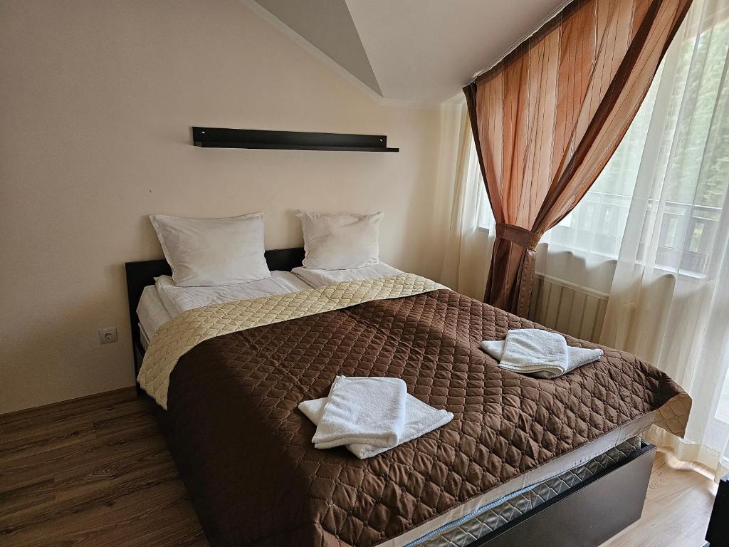 Postel nebo postele na pokoji v ubytování Apartments in Borovets Gardens